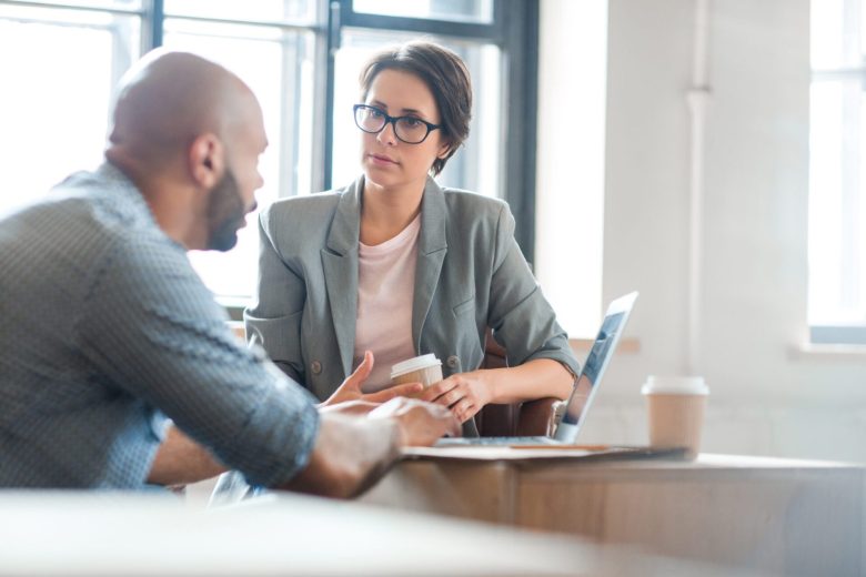 Intense discussion between coworkers over coffee